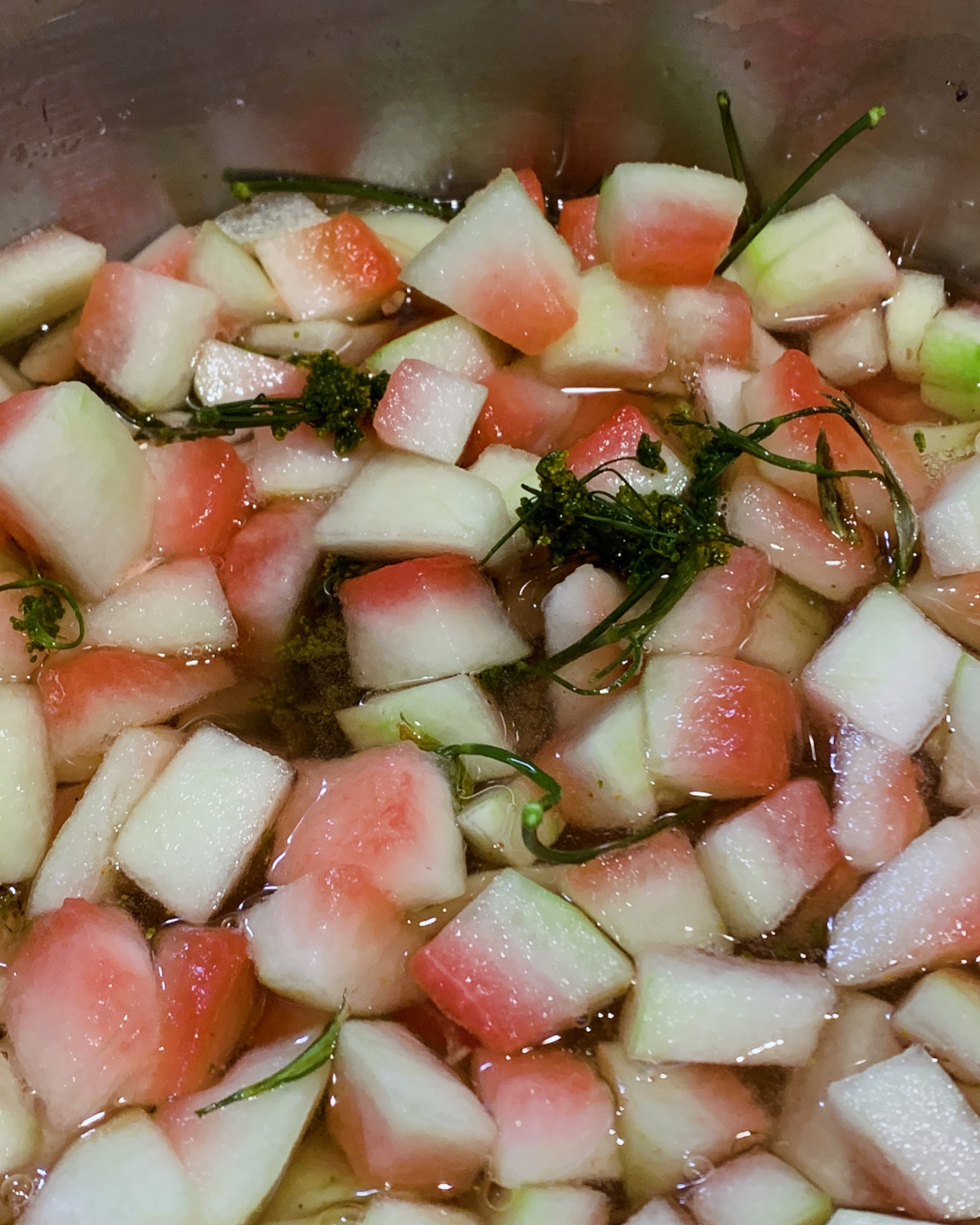 Watermelon rind in syrup with wild herbs