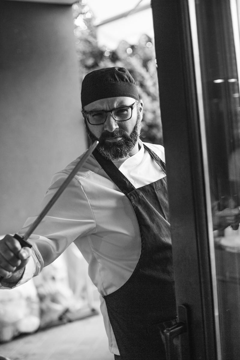 Chef Mario Traina — focused, knife in hand