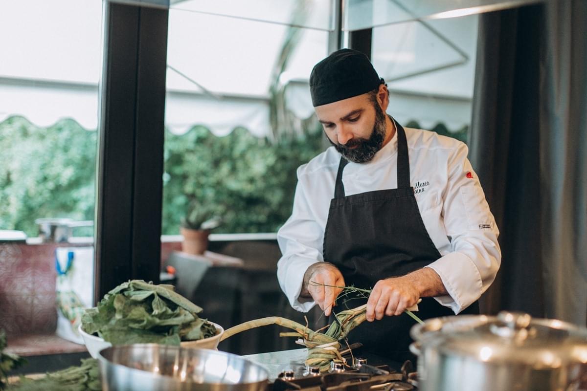 Chef Mario preparing fresh vegetables in the kitchen