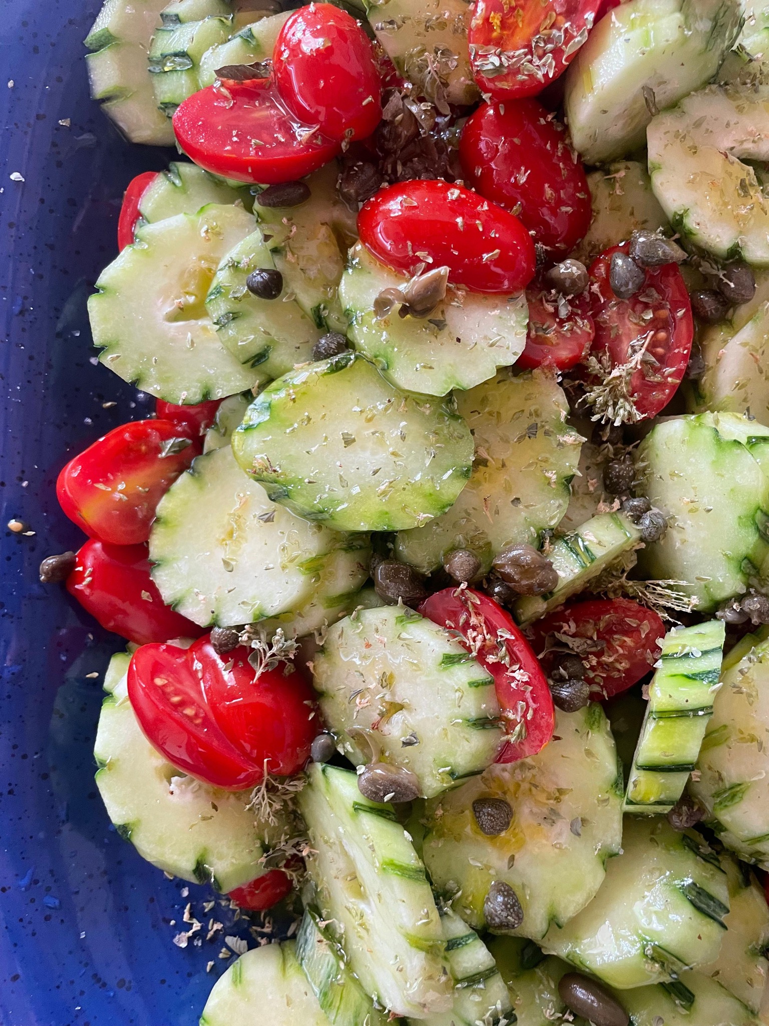 Cucumber, tomato and caper salad with wild oregano